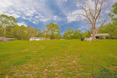 View of yard with a carport