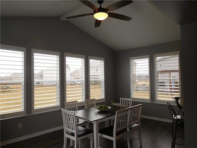 Large sun room features a cathedral ceiling. 