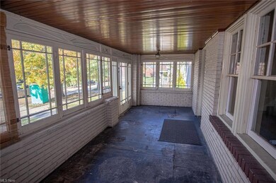 sunroom featuring wooden ceiling