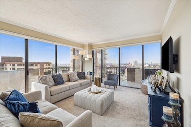 Living room features floor to ceiling windows ( th