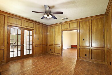 double doors leading to the master and to the foyer from the office/study
