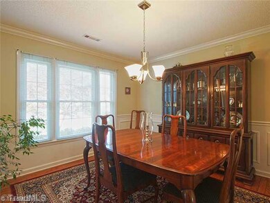Dining Room. Dining room has added decorative touches with crown molding and picture fame molding around the room.