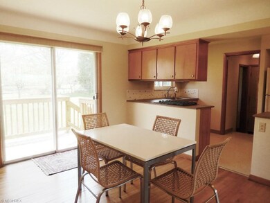 Dining room and kitchen with sliders to back yard 