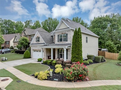Craftsman inspired home with covered porch, fence,