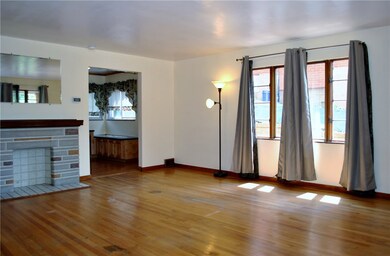 Huge living room featuring hardwood floors, large