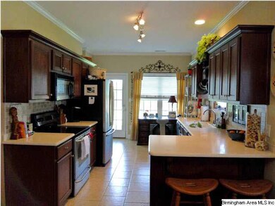 Beautiful cabinets have solid surface countertops 