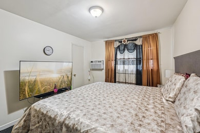 Bedroom featuring hardwood floors