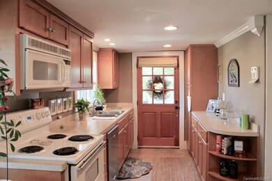 Kitchen is full of storage.