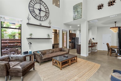 Living area featuring finished concrete floors, a