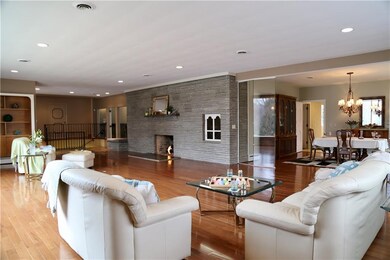 Gleaming hardwoods enhance this wonderful space.