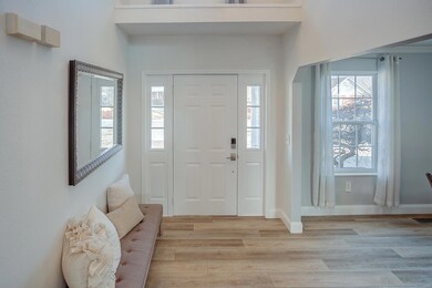 Entry foyer with display shelf and window above