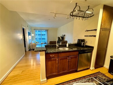 Kitchen with sink, light hardwood / wood-style flo