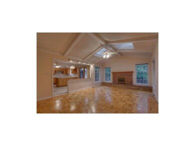 Great room w/ vaulted ceilings, skylights, firepla