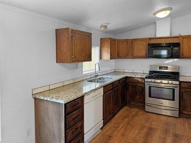 Lots of Cabinet storage with Granite countertops.