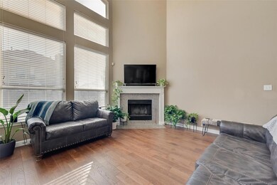Living room with hardwood / wood-style flooring an