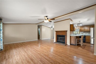 Living room with new flooring and an electric fire