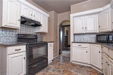 Kitchen features granite counter tops, Kraftmaid c