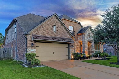 A double-wide driveway leads to the 2-car attached garage, complete with dual sconce lighting and an automatic garage door opener, for plenty of convenient parking.
