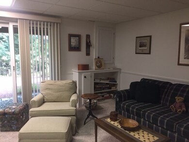 This large familyroom features neutral carpet, plenty of room for an office and unfinished storage space is a plus
