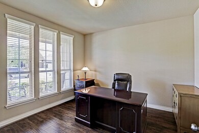 Another view of the study or could serve as a formal dining which has a door opening to the kitchen.
