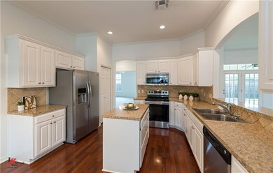 Stainless appliances in this chef's kitchen and th