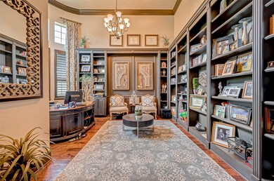 The home office is very spacious and the wall of windows provides plenty of natural light.