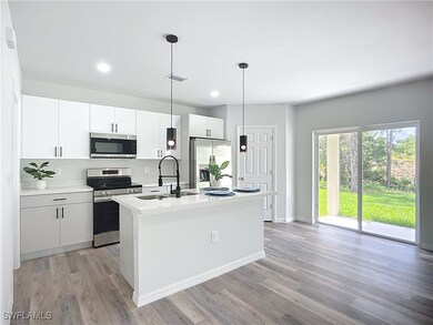 Kitchen featuring appliances with stainless steel