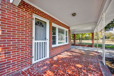 View of patio featuring covered porch