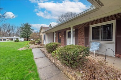 Doorway to property with a yard and a porch