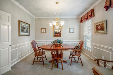 The formal dining, with chair rail accents and crown molding.