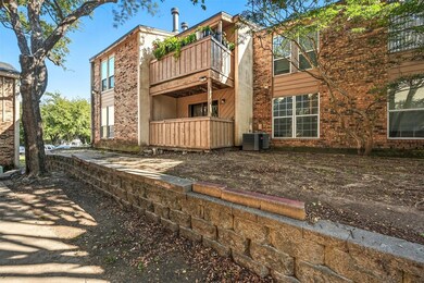Rear view of property with brick siding and a wooden deck