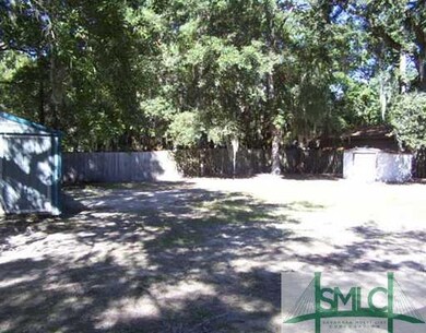 Exterior Back. FENCED BACK YARD WITH 2 STORAGE SHE