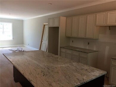 Kitchen opens up to expansive dining area