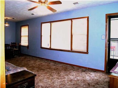 The living room as seen from the hall to the three