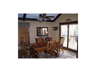 Formal Dining Room features cathedral ceiling, har