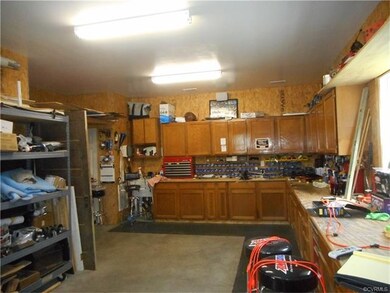work shop in the detached garage - all cabinets to