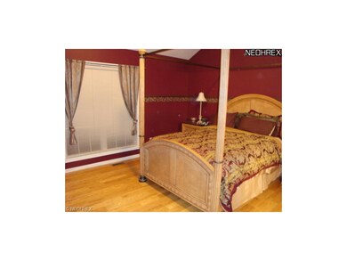 FIRST FLOOR MASTER SUITE WITH ADJOINING FULL BATH.