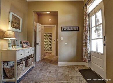 Entry and entry closet, looking into guest bath.