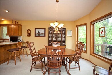 Dining room with large, picturesque windows! Open to living room and kitchen providing a great space to entertain or enjoy the family!