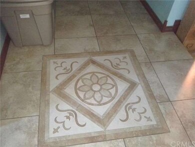 Entry tile with custom medallion.  Seller has enou