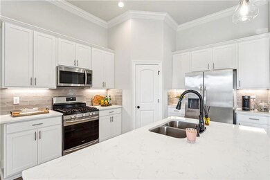 Beautiful kitchen with undermount lighting, and qu
