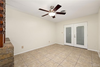 Formal Dining Room featuring Ceiling Fan and French Doors