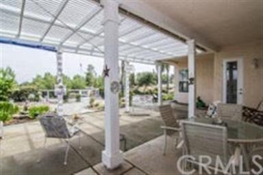 The LARGE covered patio keeps the house cool and i