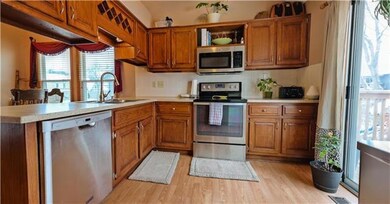 This kitchen includes a sliding glass door off of 
