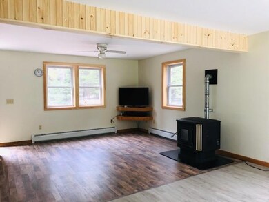 Living room w/new flooring & trim.