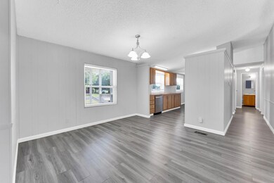 Unfurnished living room with a textured ceiling, w