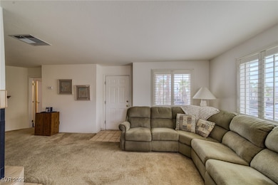 Living area with light carpet