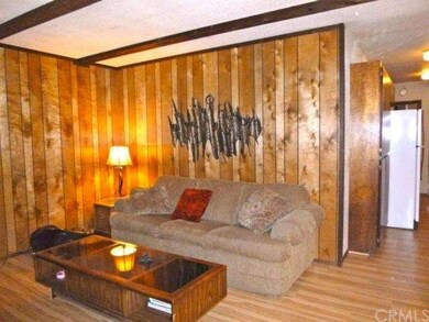 Living room open to dining and kitchen!  New lamin