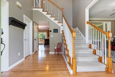 Beautiful staircase as you enter the front door.  The Hardwood throughout the home is timeless.