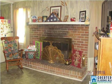 Cozy gas-log fireplace in Den